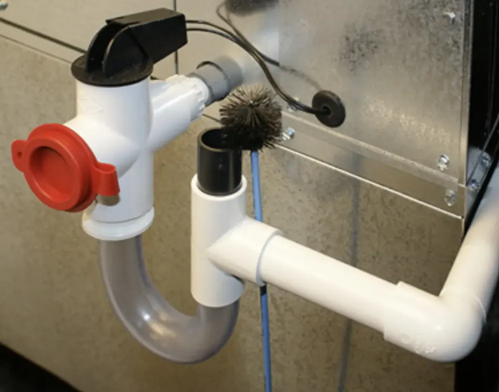 PVC condensate drain trap and piping on an air handler