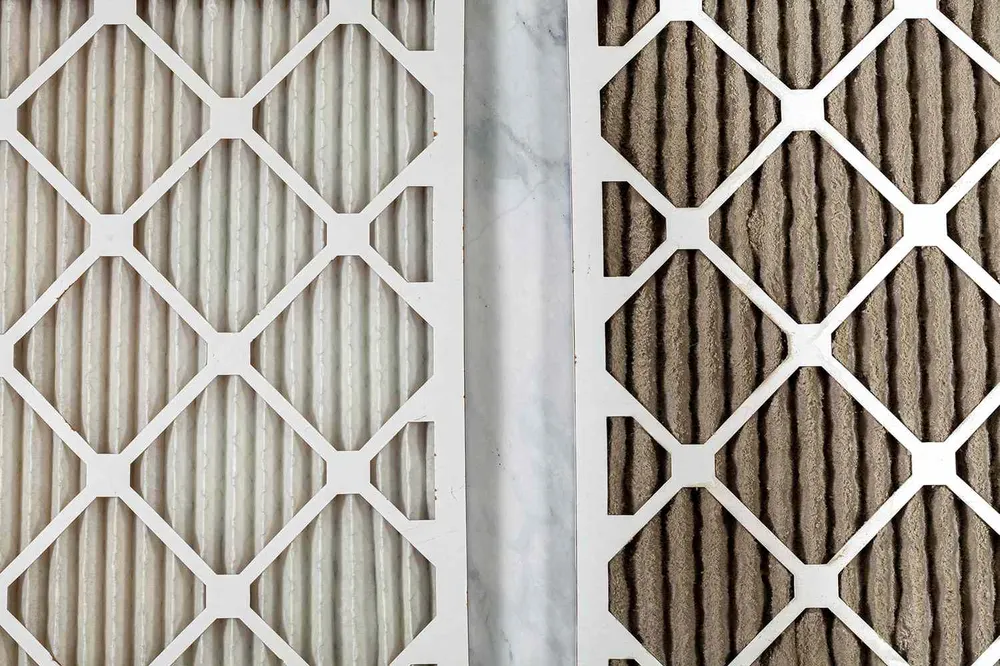 Clean filter next to a clogged, dust-covered filter