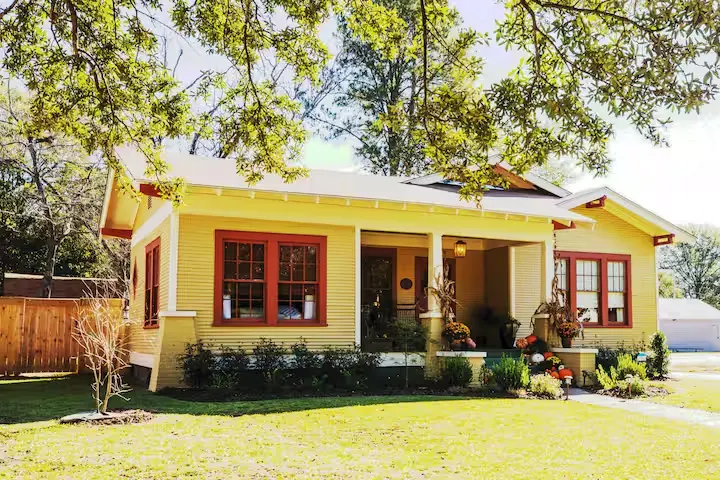 Historic Mississippi craftsman cottage in summer greenery